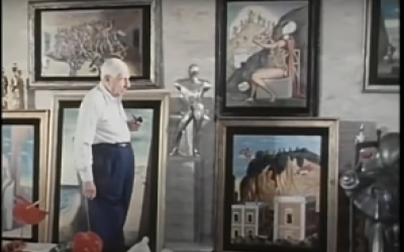 O de Chirico στο ατελιέ του (Φωτογραφία από you Tube) Κεφάλια-αυγά, άλογα, κτίρια, ερημιά